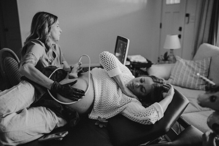 sonographer performing at home pregnancy ultrasound in Nashville living room